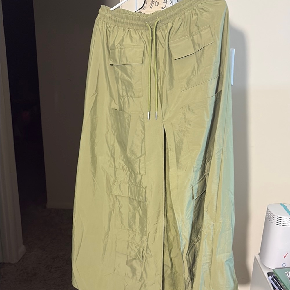 Olive Green Cargo Skirt with Long Spilt in front of Skirt with pockets.